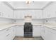Modern white kitchen with stainless steel appliances at 1520 Pelican Point Dr # 251, Sarasota, FL 34231