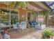 Spacious covered patio with seating area, adjacent to the pool at 3165 Stokie Ave, North Port, FL 34286