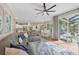 Open living room with kitchen and pool access at 3165 Stokie Ave, North Port, FL 34286
