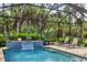 Spacious screened pool area with comfortable lounge chairs at 3165 Stokie Ave, North Port, FL 34286