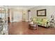 Living room with hardwood floors and floral sofa at 3165 Stokie Ave, North Port, FL 34286