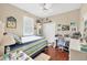 Cozy bedroom with striped bedding and a workspace at 3165 Stokie Ave, North Port, FL 34286