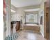 Spa-like bathroom with soaking tub and walk-in shower at 3165 Stokie Ave, North Port, FL 34286