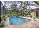 Large screened-in pool with plenty of space for lounging at 3165 Stokie Ave, North Port, FL 34286