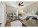 Home office with built-in shelving and a sofa at 3165 Stokie Ave, North Port, FL 34286