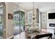 Kitchen with white chairs, round table, and view of the pool at 3165 Stokie Ave, North Port, FL 34286