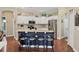 Kitchen with white cabinets, granite counters, and a breakfast bar at 3165 Stokie Ave, North Port, FL 34286