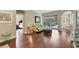 Bright living room with hardwood floors, floral sofa, and views of the pool at 3165 Stokie Ave, North Port, FL 34286