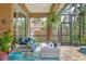 Covered patio with comfortable seating overlooking the pool at 3165 Stokie Ave, North Port, FL 34286