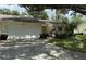 Front view of single Gathering home with attached garage and landscaping at 3925 Oakhurst Blvd # 3010, Sarasota, FL 34233