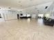 Spacious community room with seating and TV at 3925 Oakhurst Blvd # 3010, Sarasota, FL 34233
