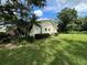 Exterior of house showcasing landscaping and backyard at 3925 Oakhurst Blvd # 3010, Sarasota, FL 34233