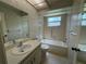 Bathroom with single vanity, shower, and hexagonal tile floor at 3925 Oakhurst Blvd # 3010, Sarasota, FL 34233
