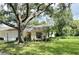 Ranch style home with carport and mature landscaping at 3925 Oakhurst Blvd # 3010, Sarasota, FL 34233