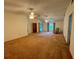 Spacious living room with carpet, ceiling fans and built-in shelving at 3925 Oakhurst Blvd # 3010, Sarasota, FL 34233