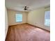 Spacious carpeted bedroom with large window and ceiling fan at 3925 Oakhurst Blvd # 3010, Sarasota, FL 34233