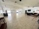 Spacious community room with seating and TV at 3925 Oakhurst Blvd # 3010, Sarasota, FL 34233