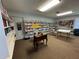 Community library with books, games, and a table at 3925 Oakhurst Blvd # 3010, Sarasota, FL 34233