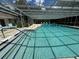 Community pool with covered seating area at 3925 Oakhurst Blvd # 3010, Sarasota, FL 34233