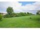 Spacious backyard with pond view and lush green grass at 13592 Clara Ln, Port Charlotte, FL 33981