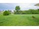 Spacious backyard with pond view and lush green grass at 13592 Clara Ln, Port Charlotte, FL 33981