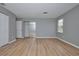 Large bedroom with mirrored closet and wood-look floors at 13592 Clara Ln, Port Charlotte, FL 33981
