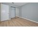 Bedroom with mirrored closet and laminate wood floor at 13592 Clara Ln, Port Charlotte, FL 33981