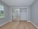 Bedroom with mirrored closet and window at 13592 Clara Ln, Port Charlotte, FL 33981
