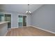 Bright dining area with glass sliders and chandelier at 13592 Clara Ln, Port Charlotte, FL 33981