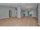 Open dining area with kitchen and wood-look floors at 13592 Clara Ln, Port Charlotte, FL 33981