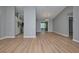 Open dining room with kitchen and wood-look flooring at 13592 Clara Ln, Port Charlotte, FL 33981
