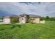 Tan house with palm trees and driveway at 13592 Clara Ln, Port Charlotte, FL 33981