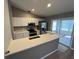 Modern kitchen with breakfast bar and stainless steel appliances at 13592 Clara Ln, Port Charlotte, FL 33981