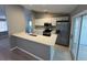 Modern kitchen with stainless steel appliances and white cabinets at 13592 Clara Ln, Port Charlotte, FL 33981