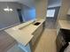 Modern kitchen with L-shaped island and breakfast bar at 13592 Clara Ln, Port Charlotte, FL 33981