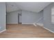 Bright living room with vaulted ceiling and wood-look flooring at 13592 Clara Ln, Port Charlotte, FL 33981