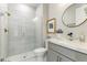 Elegant bathroom with a frameless glass shower and gray tile at 16210 Hidden Oak Loop, Lakewood Ranch, FL 34211