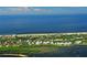 Aerial view of a coastal community by the sea with lush tropical foliage at 1945 Gulf Of Mexico Dr # M2-310, Longboat Key, FL 34228