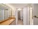 Bathroom featuring a granite countertop vanity, a shower, and neutral colored fixtures at 1945 Gulf Of Mexico Dr # M2-310, Longboat Key, FL 34228