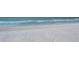 Sandy beach with ocean waves crashing on the shoreline at 1945 Gulf Of Mexico Dr # M2-310, Longboat Key, FL 34228
