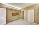 Bedroom featuring a bi-fold closet, tile floors, and neutral colored walls at 1945 Gulf Of Mexico Dr # M2-310, Longboat Key, FL 34228