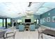 Community room with comfortable seating, modern lighting, and ocean views at 1945 Gulf Of Mexico Dr # M2-310, Longboat Key, FL 34228