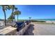 Community grill area with multiple cooking stations and ocean views at 1945 Gulf Of Mexico Dr # M2-310, Longboat Key, FL 34228
