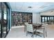 Cozy reading room with an extensive bookshelf, tables and chairs, and beautiful water views at 1945 Gulf Of Mexico Dr # M2-310, Longboat Key, FL 34228