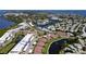 Aerial view of community, showing building, pool, tennis court, and lush landscaping at 4819 Independence Dr # 4819, Bradenton, FL 34210