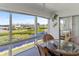 Lanai with water views and wicker furniture at 4819 Independence Dr # 4819, Bradenton, FL 34210