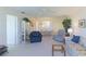 Living room with comfy seating and a view to lanai at 4819 Independence Dr # 4819, Bradenton, FL 34210
