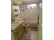 Bathroom with tub, shower, and double sink vanity at 411 Briarwood Rd, Venice, FL 34293