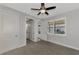 Bedroom with private bathroom access and sliding doors to patio at 906 E Venice Ave, Venice, FL 34285