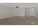 Open living area with tile floors and access to entryway and stairs at 906 E Venice Ave, Venice, FL 34285